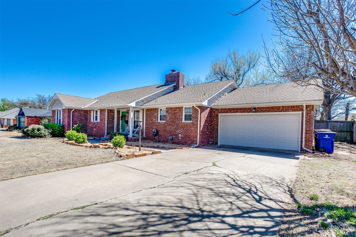 1504 Brighton Avenue, Oklahoma City, OK 73120 ranch-style home featuring a garage