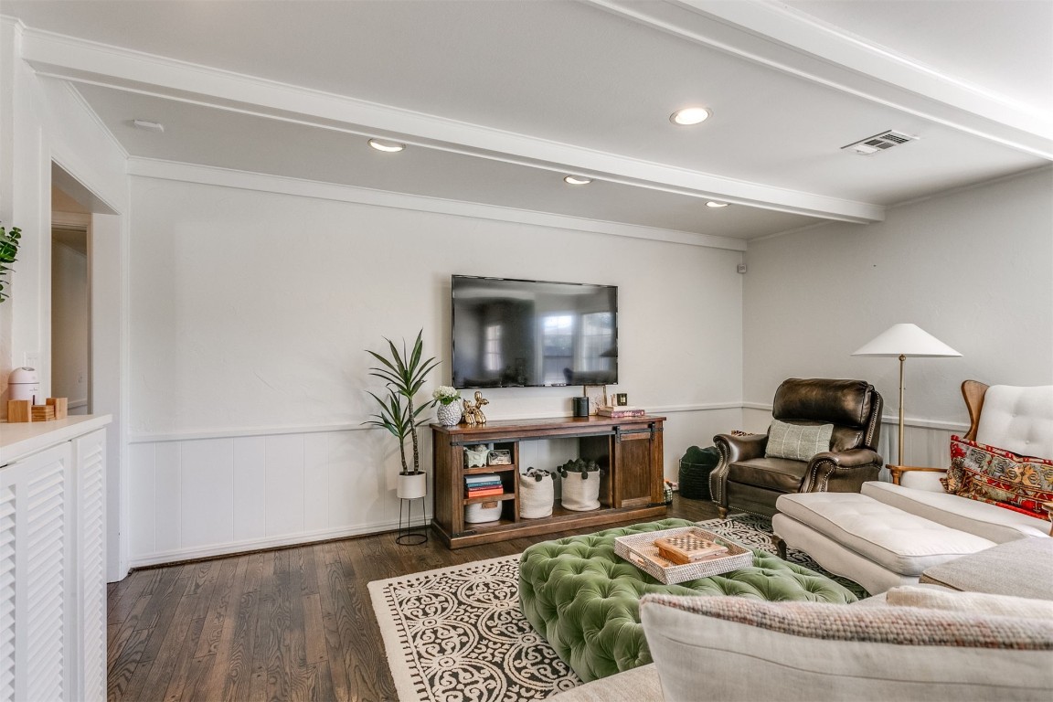 1504 Brighton Avenue, Oklahoma City, OK 73120 living room featuring beam ceiling and dark hardwood / wood-style flooring