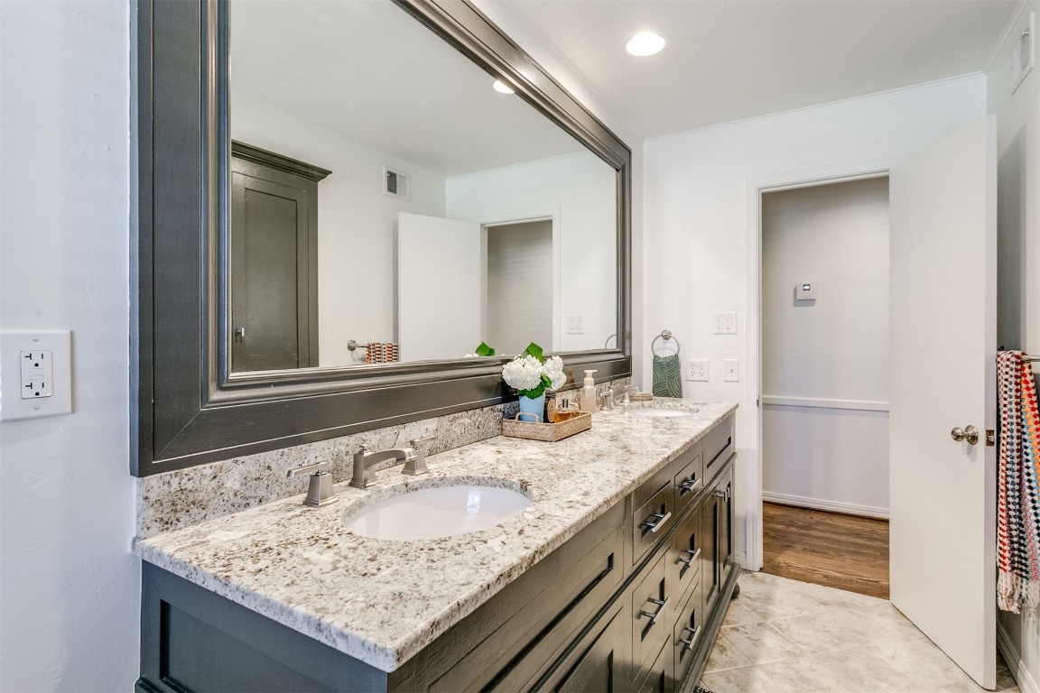 1504 Brighton Avenue, Oklahoma City, OK 73120 bathroom with tile flooring and dual bowl vanity
