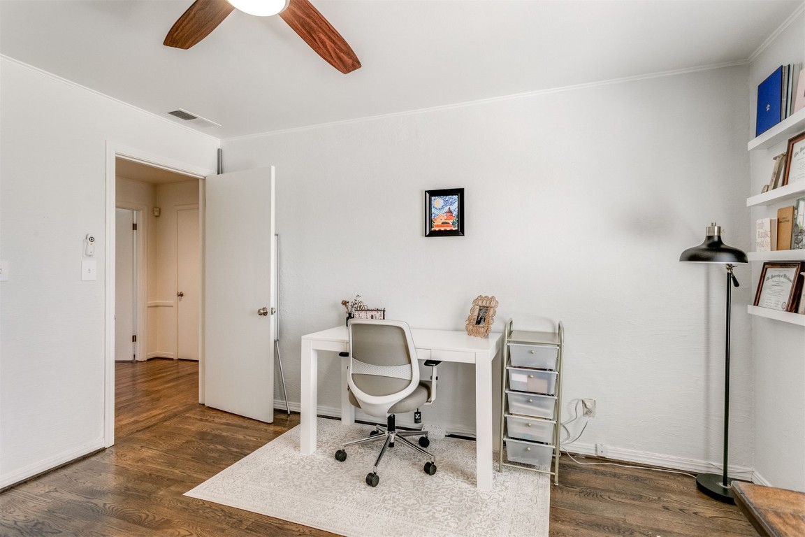 1504 Brighton Avenue, Oklahoma City, OK 73120 office space featuring ceiling fan, dark wood-type flooring, and ornamental molding