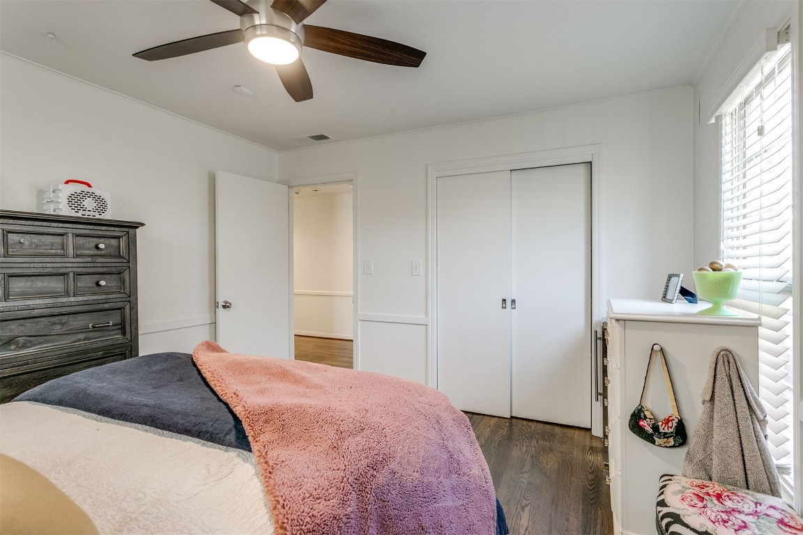 1504 Brighton Avenue, Oklahoma City, OK 73120 bedroom featuring dark hardwood / wood-style flooring, ceiling fan, and a closet