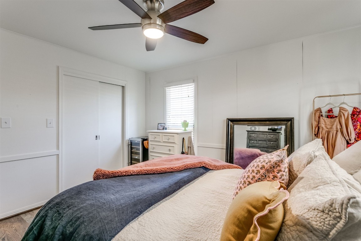 1504 Brighton Avenue, Oklahoma City, OK 73120 bedroom with light hardwood / wood-style flooring, ceiling fan, and a closet