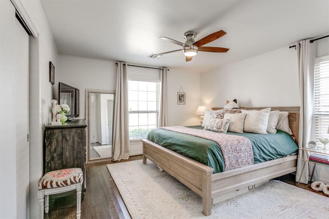1504 Brighton Avenue, Oklahoma City, OK 73120 bedroom featuring a closet, ceiling fan, and hardwood / wood-style floors