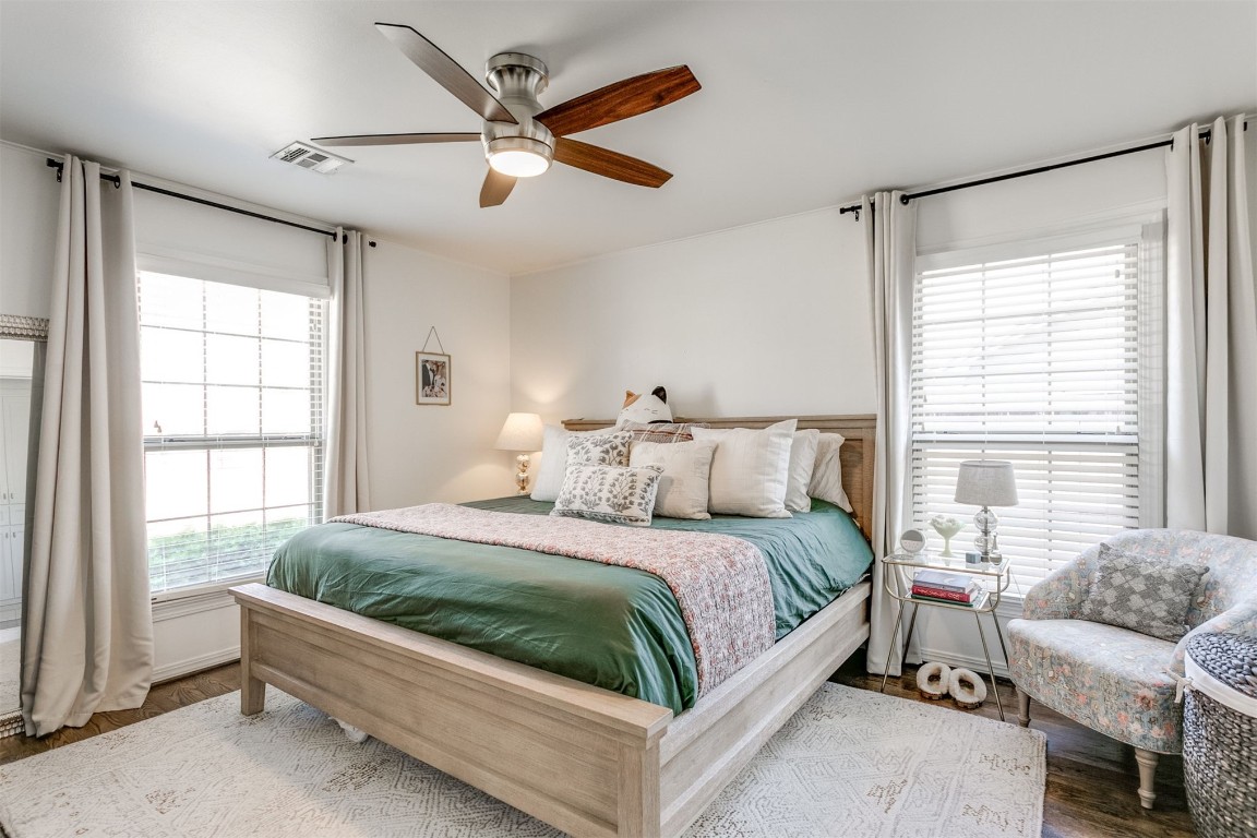 1504 Brighton Avenue, Oklahoma City, OK 73120 bedroom with ceiling fan and hardwood / wood-style flooring
