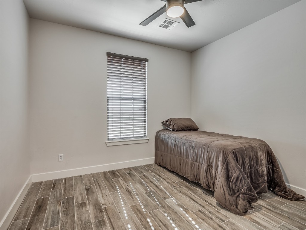 901 Jacobs Way, Yukon, OK 73099 bedroom featuring ceiling fan and light hardwood / wood-style floors