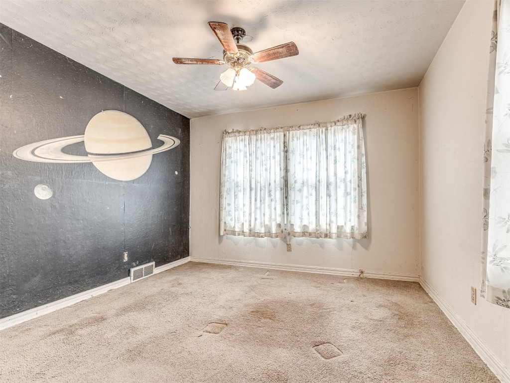 4805 N Hamilton Drive, Oklahoma City, OK 73112 carpeted spare room with ceiling fan
