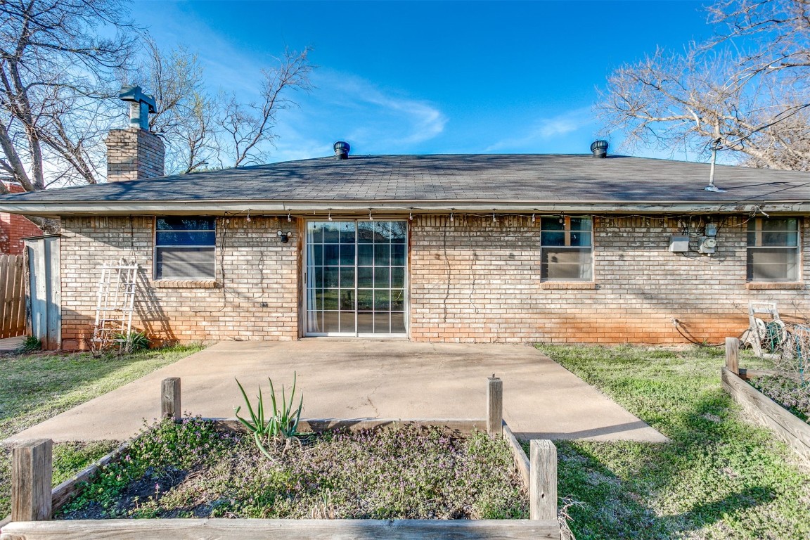 5504 NW 67th Street, Warr Acres, OK 73132 back of property featuring a patio