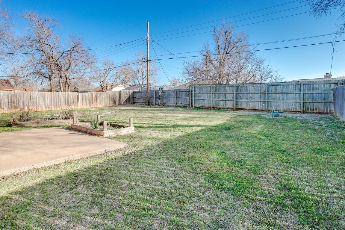 5504 NW 67th Street, Warr Acres, OK 73132 view of yard with a patio area