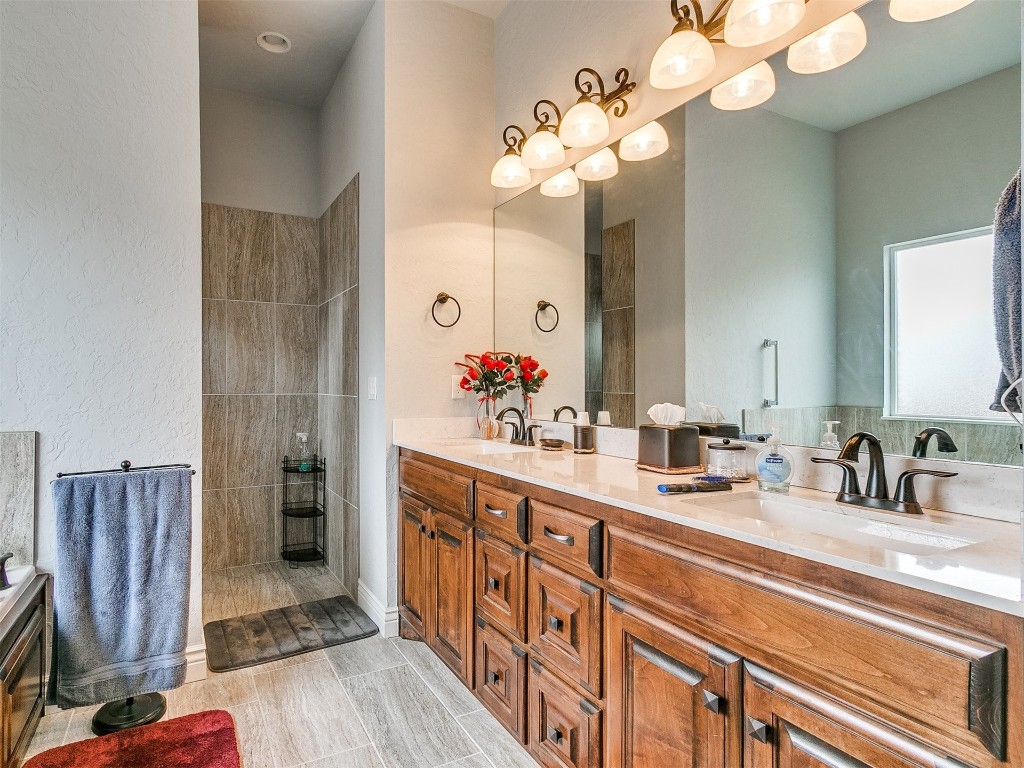 11004 Milford Lane, Oklahoma City, OK 73122 bathroom featuring double vanity and tile flooring