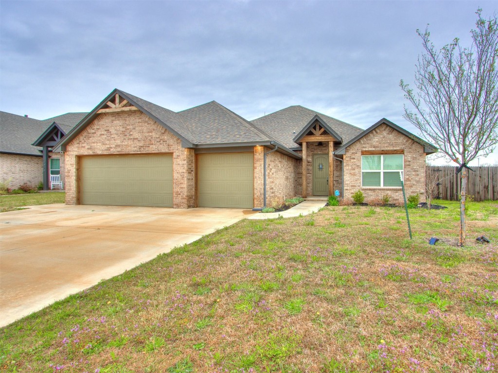 4832 Bermuda Drive, Mustang, OK 73064 view of front of house featuring a garage and a front yard