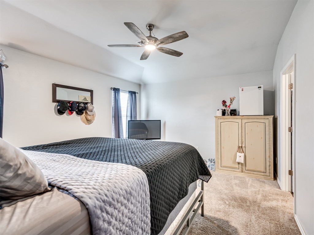 11016 NW 99th Street, Yukon, OK 73099 carpeted bedroom featuring ceiling fan