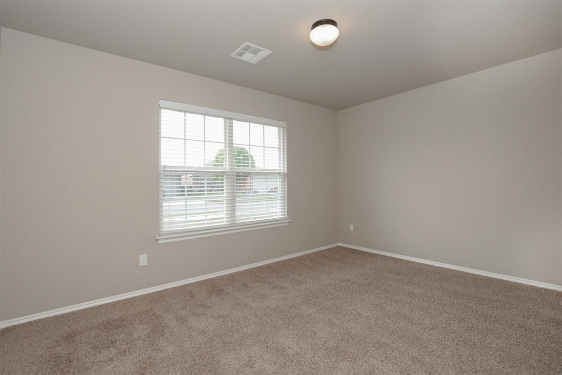 8417 SW 48th Street, Oklahoma City, OK 73179 unfurnished room featuring carpet flooring