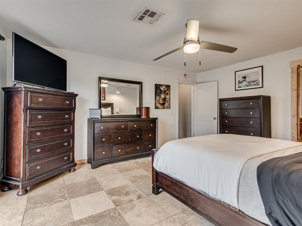 6313 Chatham Road, Oklahoma City, OK 73132 tiled bedroom featuring ceiling fan