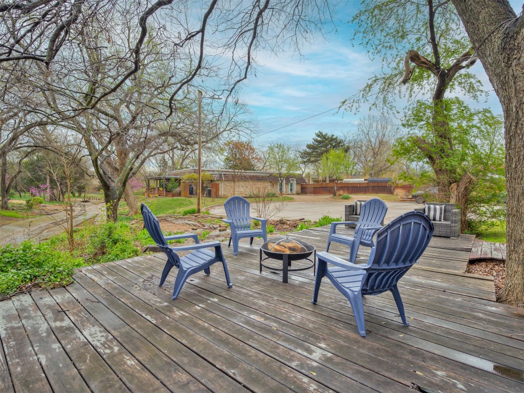 6313 Chatham Road, Oklahoma City, OK 73132 deck featuring an outdoor fire pit