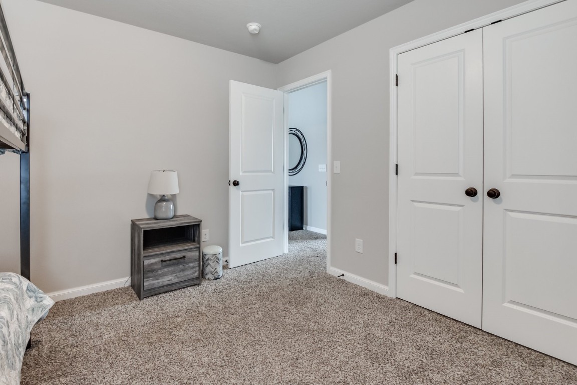 1311 SE 17th Street, Newcastle, OK 73065 bedroom featuring a closet and light colored carpet