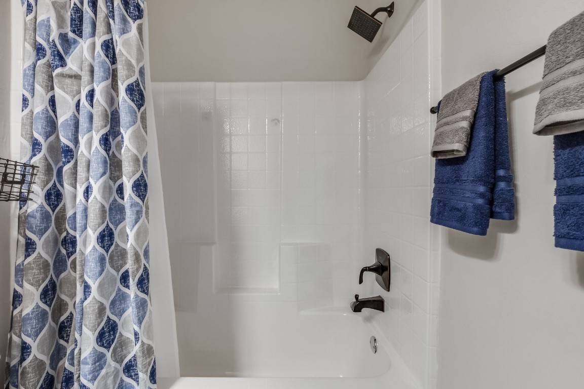 1311 SE 17th Street, Newcastle, OK 73065 bathroom with shower / bath combination with curtain