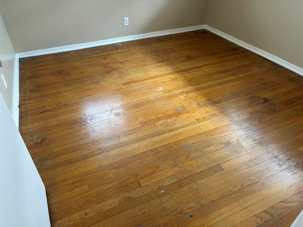 1125 NW 88th Street, Oklahoma City, OK 73114 interior space featuring dark hardwood / wood-style floors