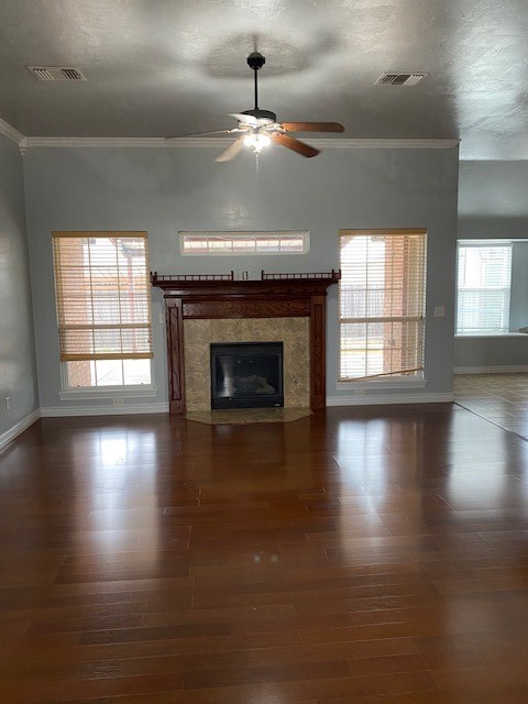 2800 SW 92nd Court, Oklahoma City, OK 73159 unfurnished living room with ornamental molding, ceiling fan, and dark hardwood / wood-style flooring
