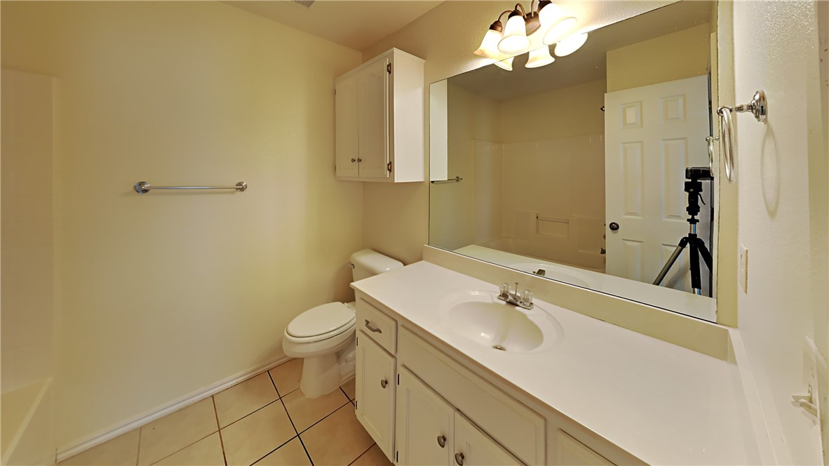 1400 SW 23rd Street, Moore, OK 73170 full bathroom with shower / bath combination, toilet, large vanity, and tile floors