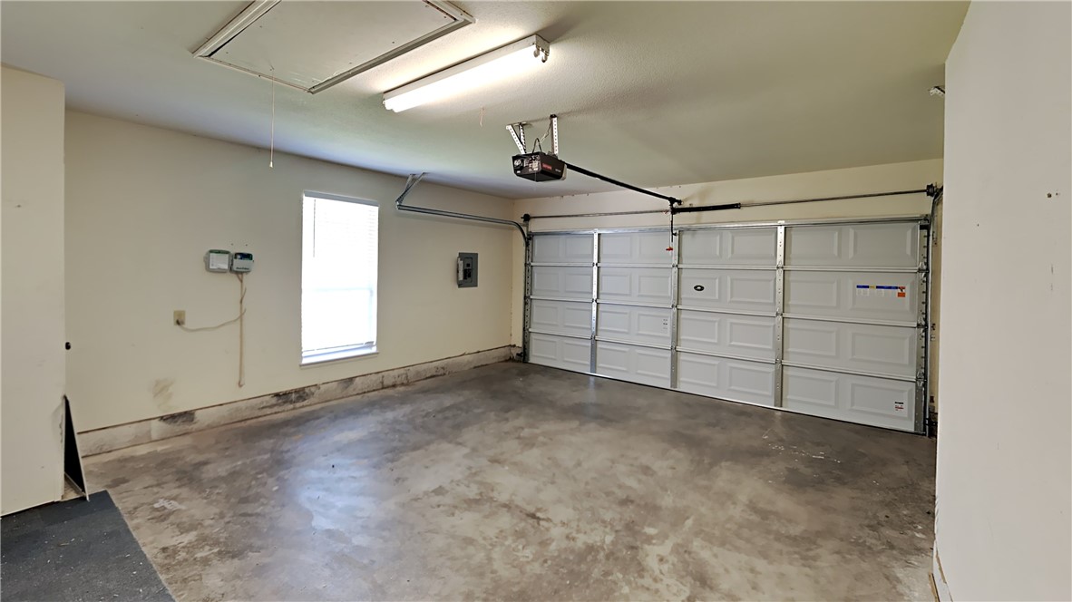 1400 SW 23rd Street, Moore, OK 73170 garage with a garage door opener
