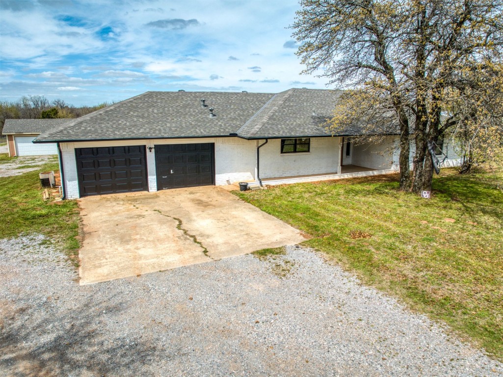 805 S Hwy 76 Highway, Newcastle, OK 73065 ranch-style house with a front yard and a garage