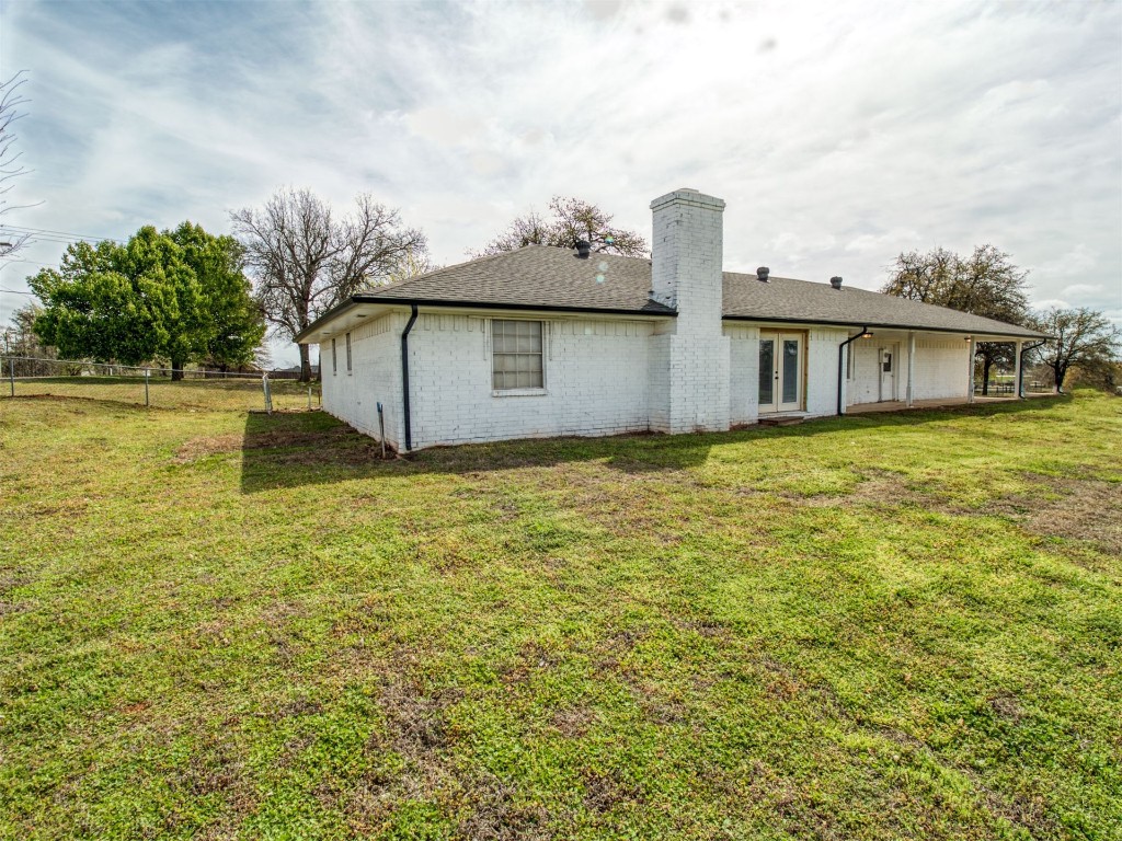 805 S Hwy 76 Highway, Newcastle, OK 73065 back of property with a lawn