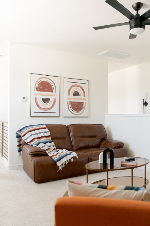 2532 Amante Court, Edmond, OK 73034 living room featuring light carpet and ceiling fan
