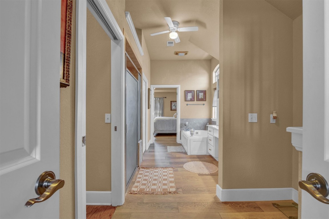 1312 SW 126th Street, Oklahoma City, OK 73170 hallway featuring light hardwood / wood-style flooring