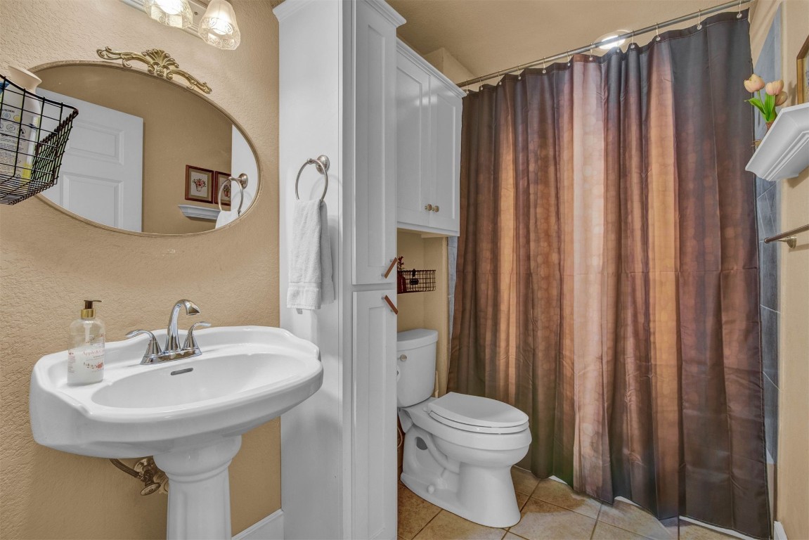 1312 SW 126th Street, Oklahoma City, OK 73170 bathroom featuring tile floors and toilet