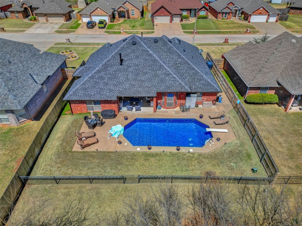 1312 SW 126th Street, Oklahoma City, OK 73170 view of pool with a yard, a patio area, and a diving board