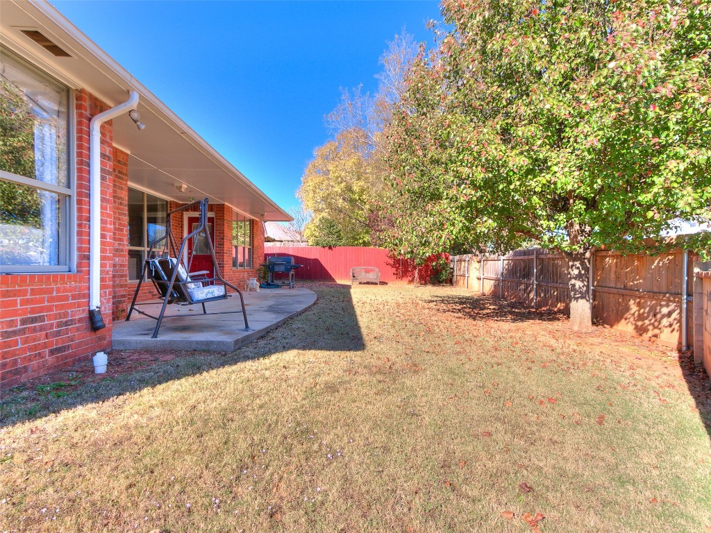 1989 Long Trail Court, Edmond, OK 73012 view of yard with a patio area
