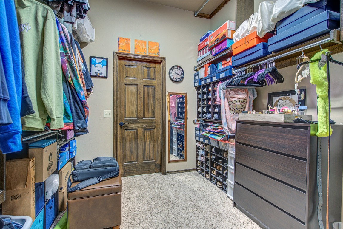 4904 SW 130th Street, Oklahoma City, OK 73173 spacious closet featuring carpet