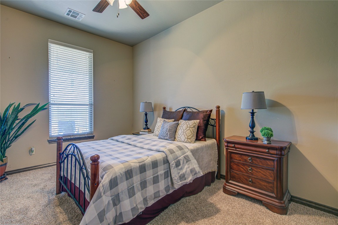 4904 SW 130th Street, Oklahoma City, OK 73173 carpeted bedroom with ceiling fan