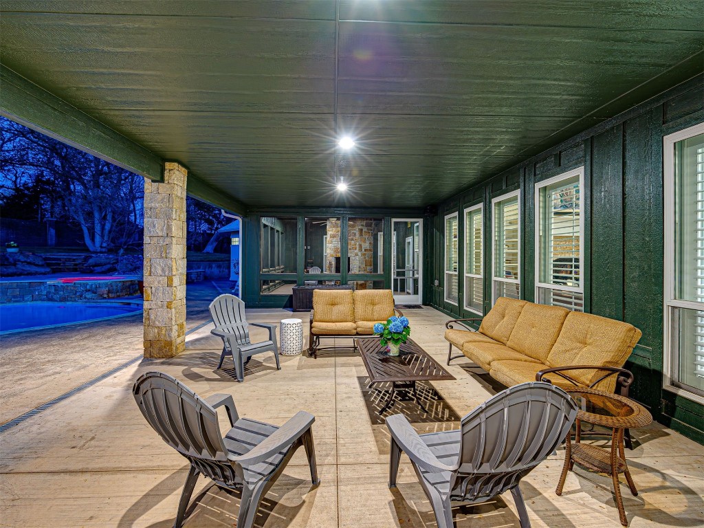 4101 Oakdale Farm Circle, Edmond, OK 73013 patio terrace at twilight featuring outdoor lounge area