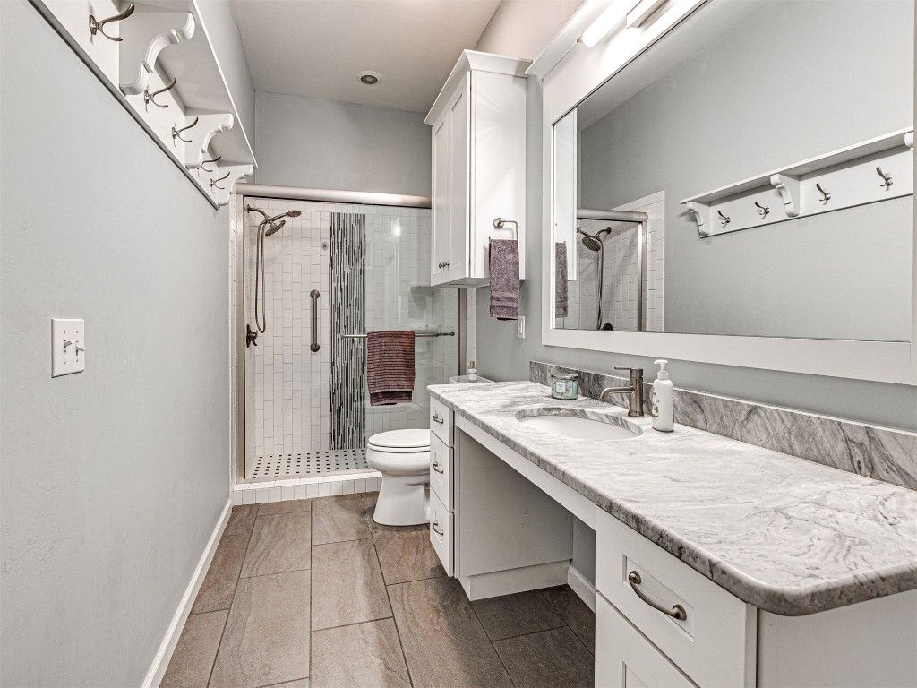 4101 Oakdale Farm Circle, Edmond, OK 73013 bathroom with toilet, tile flooring, an enclosed shower, and vanity