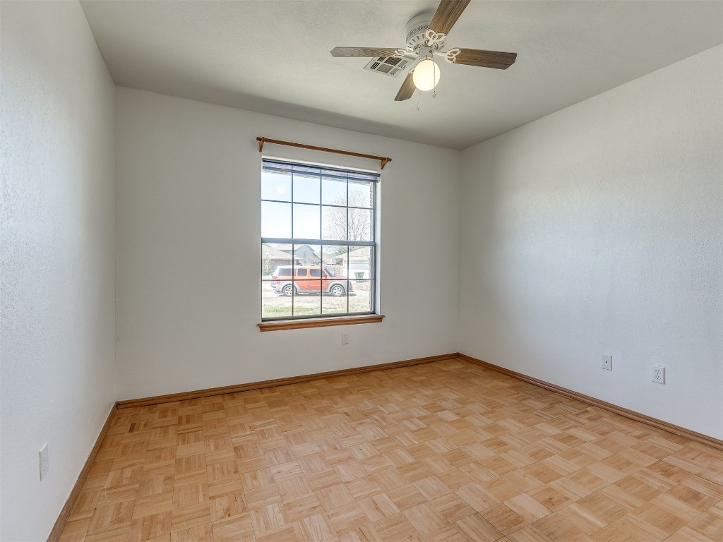 100 Parkdale Court, Noble, OK 73068 empty room featuring ceiling fan and light parquet flooring