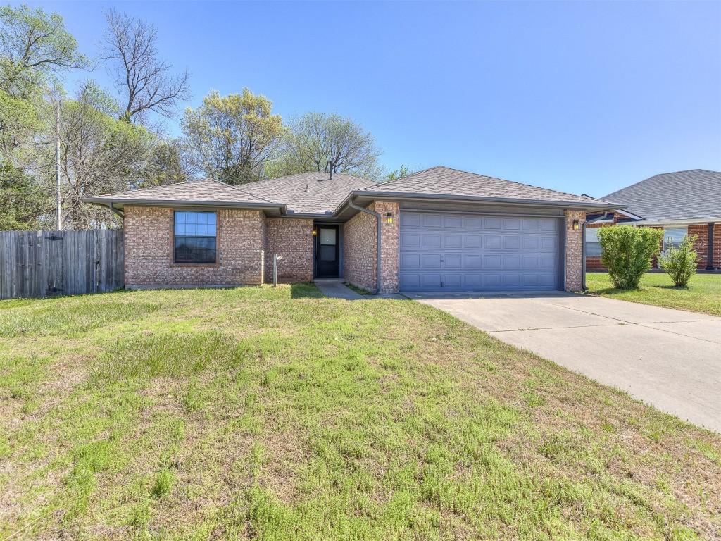100 Parkdale Court, Noble, OK 73068 ranch-style home with a front lawn and a garage