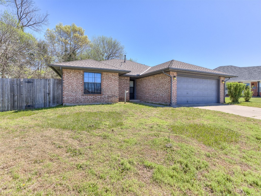 100 Parkdale Court, Noble, OK 73068 ranch-style house with a front lawn and a garage
