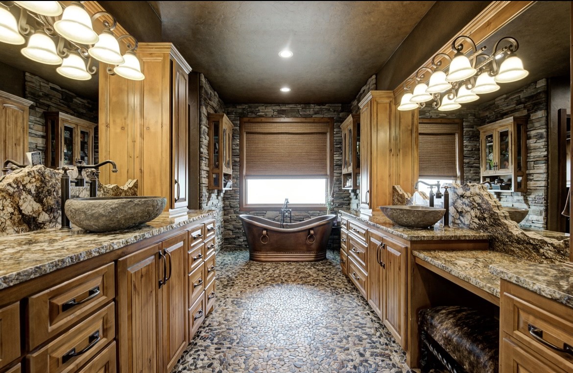 5012 S Western Road, Stillwater, OK 74074 bathroom with vanity and a tub