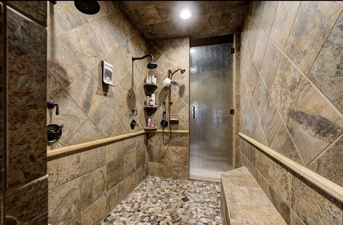 5012 S Western Road, Stillwater, OK 74074 bathroom featuring a tile shower