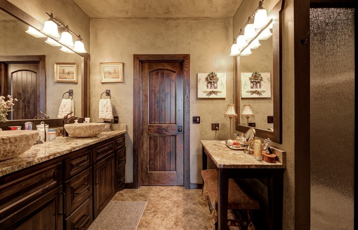 5012 S Western Road, Stillwater, OK 74074 bathroom featuring double sink vanity and tile floors