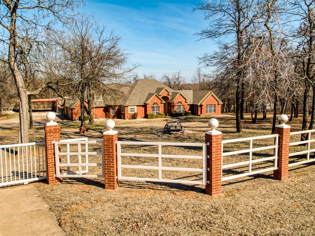Gated 5-ACRE MOL WOODED HORSES/FARM ANIMALS WELCOME!!  2.67 Mature Growth Back 1/2 of property. Make it your own! No building Restrictions. 5 Bedrooms and 2.5 Bathrooms. Upstairs Bonus room can be used as the 6th bedroom.  3 Car Garage Attached. 3564 SQFT Living Area. Private Water Well. DEQ Water Tested and Approved. Large spacious Kitchen with granite surfaced countertops throughout. Property Surrounded by Wrought Iron Fenced. Slide Gate with Stable, Barn, Exterior Storage buildings, and underground storm shelter. Large 24X30 SQFT Shop With Electric. 840 SQFT Metal Carport. 256 SQFT Wood Covered Pavilion. Easy access commuting to I-240 and I-40.#OklahomaRealEstate
#Gated
#AnimalFriendly
#5AcresMOL
