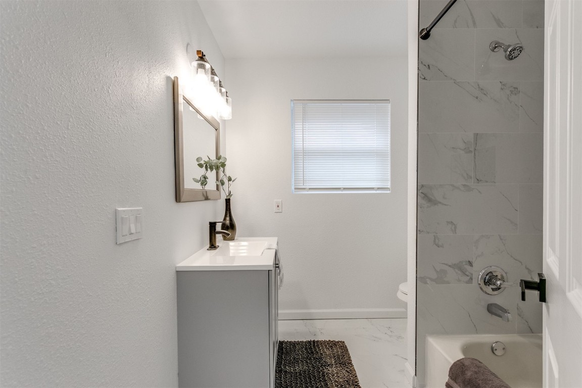 3313 Sherman Avenue, Oklahoma City, OK 73111 full bathroom featuring tile floors, toilet, vanity, and tiled shower / bath