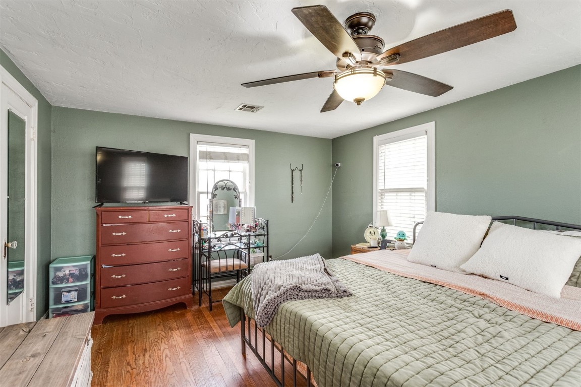 3104 NW 12th Street, Oklahoma City, OK 73107 bedroom featuring dark hardwood / wood-style flooring and ceiling fan