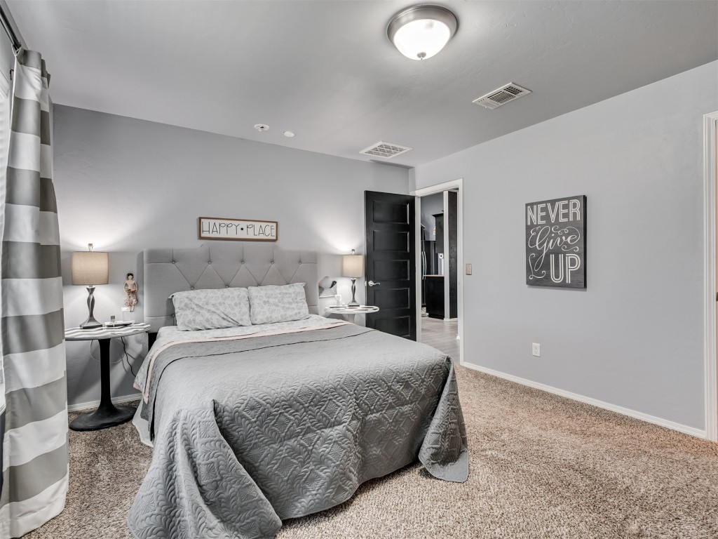 18620 Ochoa Drive, Edmond, OK 73012 view of carpeted bedroom