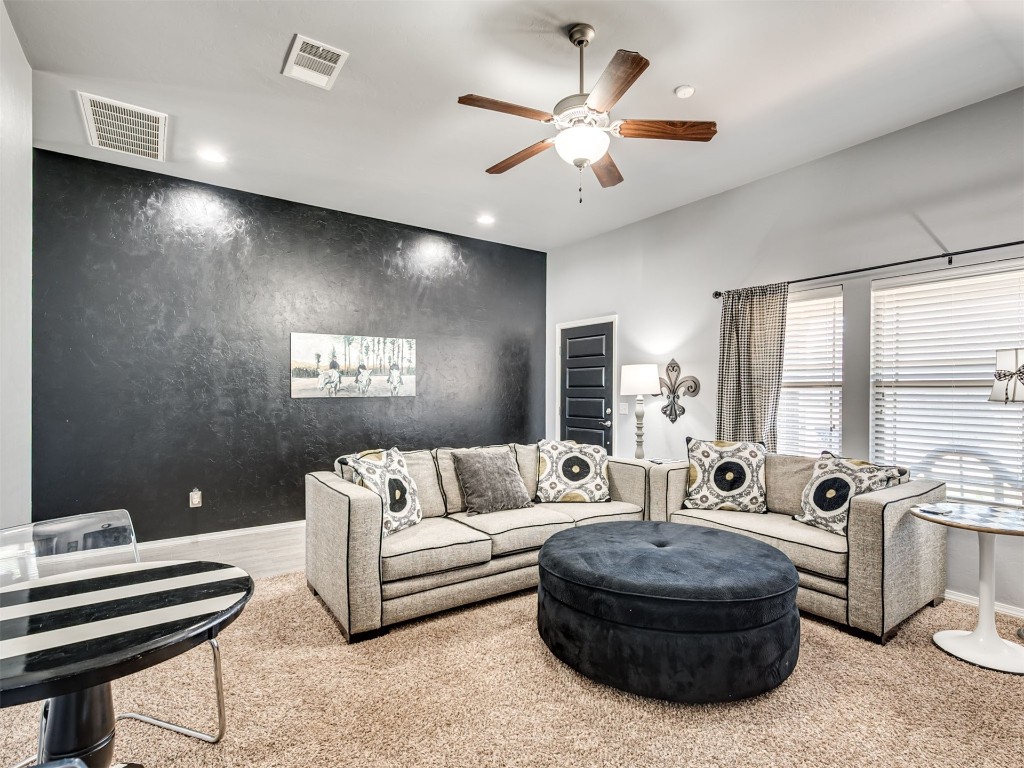 18620 Ochoa Drive, Edmond, OK 73012 carpeted living room featuring ceiling fan