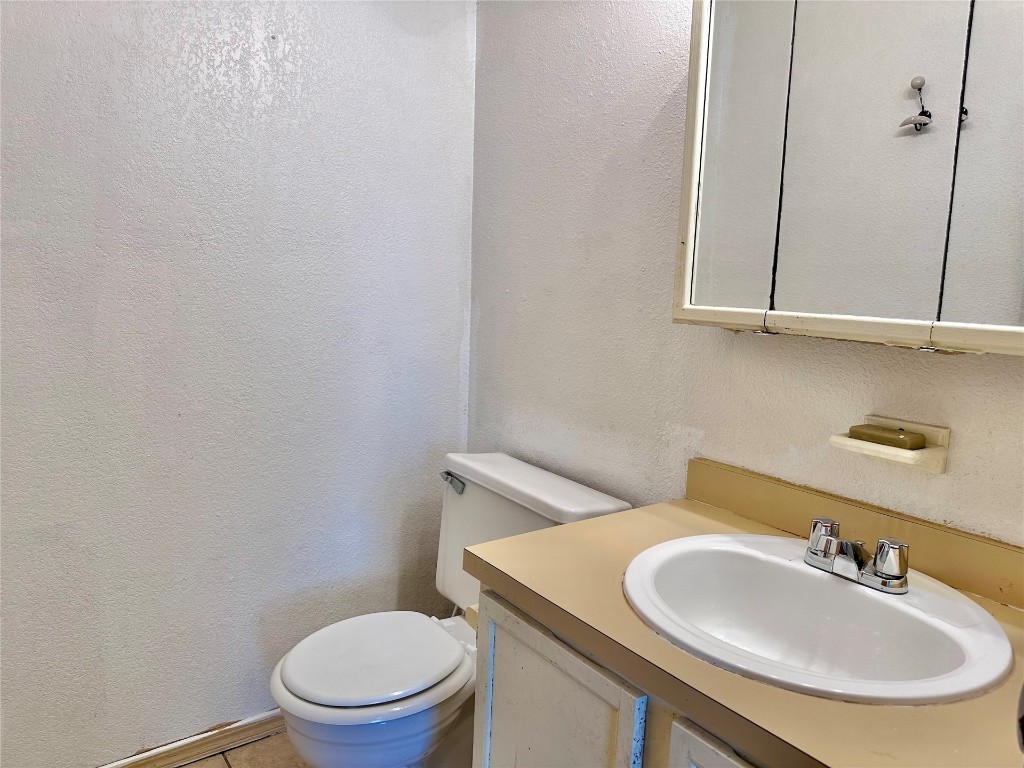 1100 SW 101st Street, Oklahoma City, OK 73139 bathroom featuring vanity and toilet