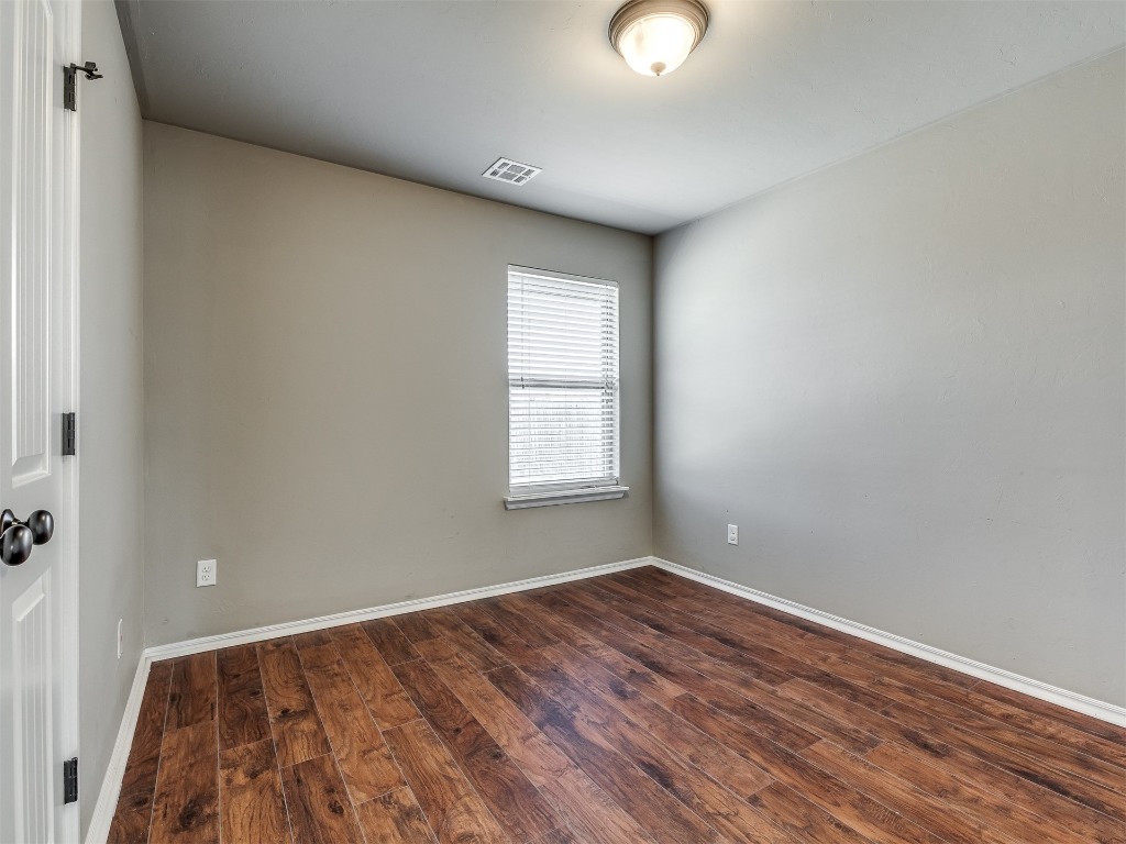 2333 NW 196th Terrace, Edmond, OK 73012 empty room with dark hardwood / wood-style flooring