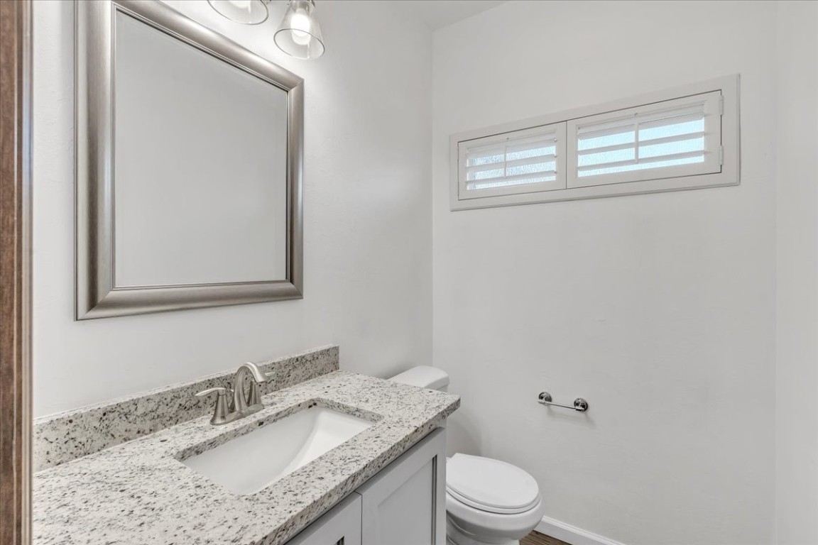 13504 Rock Canyon Road, Oklahoma City, OK 73142 bathroom featuring toilet and vanity