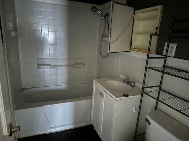 1713 N Quapah Avenue, Oklahoma City, OK 73107 full bathroom with tile flooring, toilet, bathing tub / shower combination, and vanity
